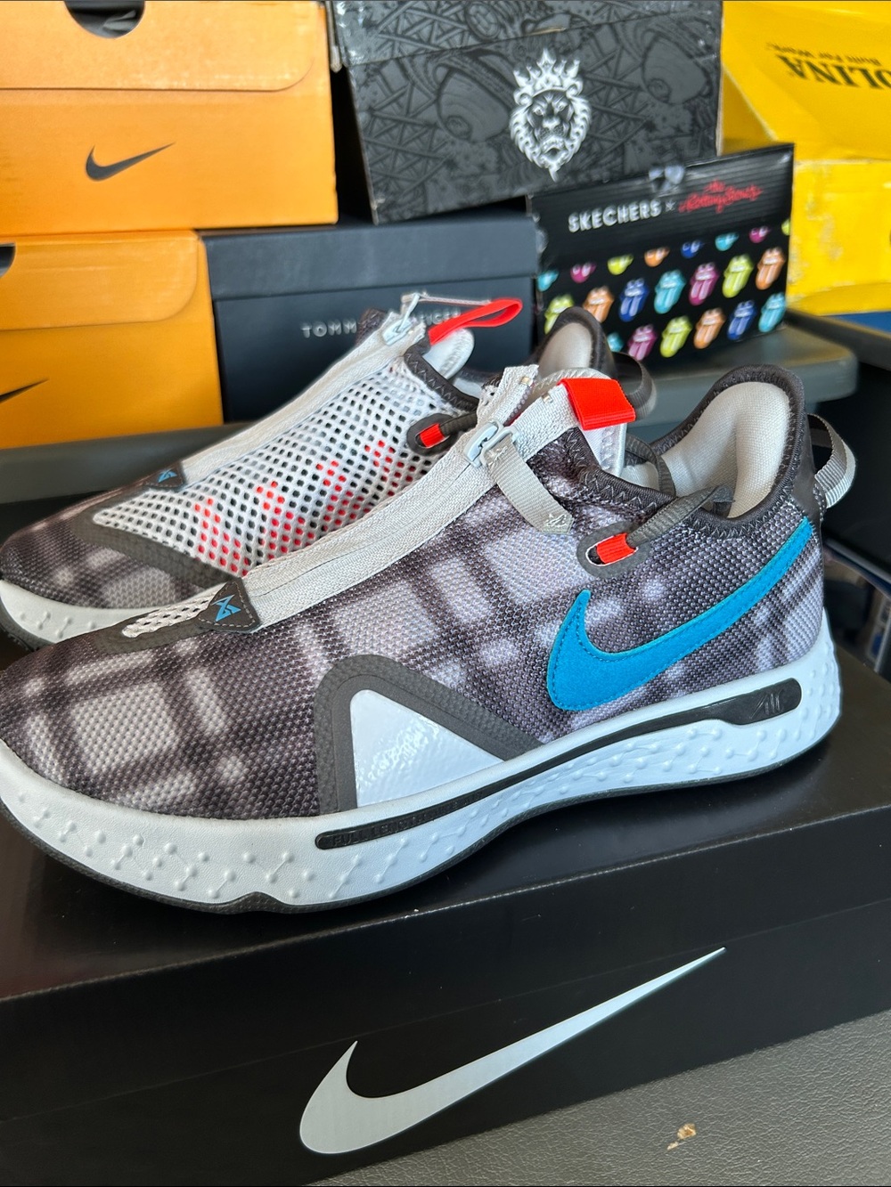 Nike Gray Patterned Slip-On Sneakers with Blue Swoosh and Red Accents